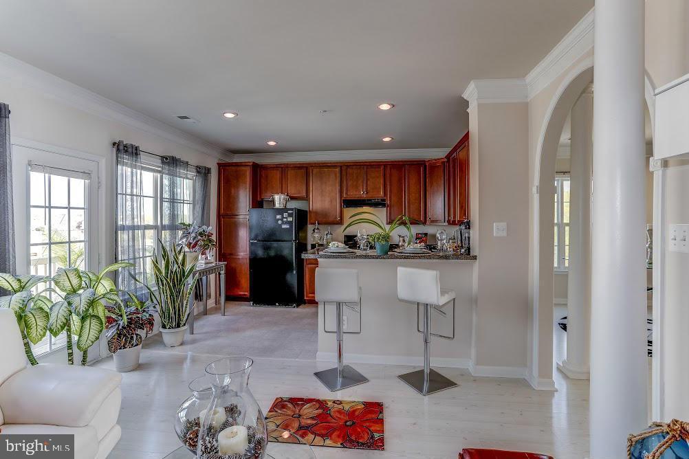 1838 B Monocacy View Circle, Unit 55B Frederick, MD 21701 - Photo 21 of 28 a kitchen with stainless steel appliances kitchen island granite countertop a refrigerator and a sink