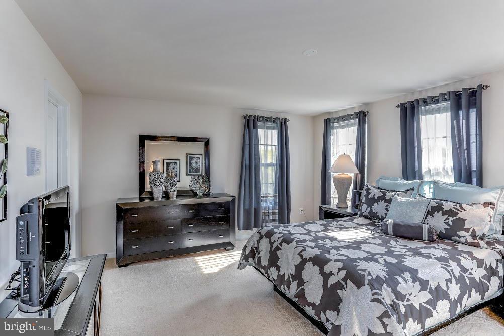 1838 B Monocacy View Circle, Unit 55B Frederick, MD 21701 - Photo 24 of 28 a bedroom with a bed and a couch