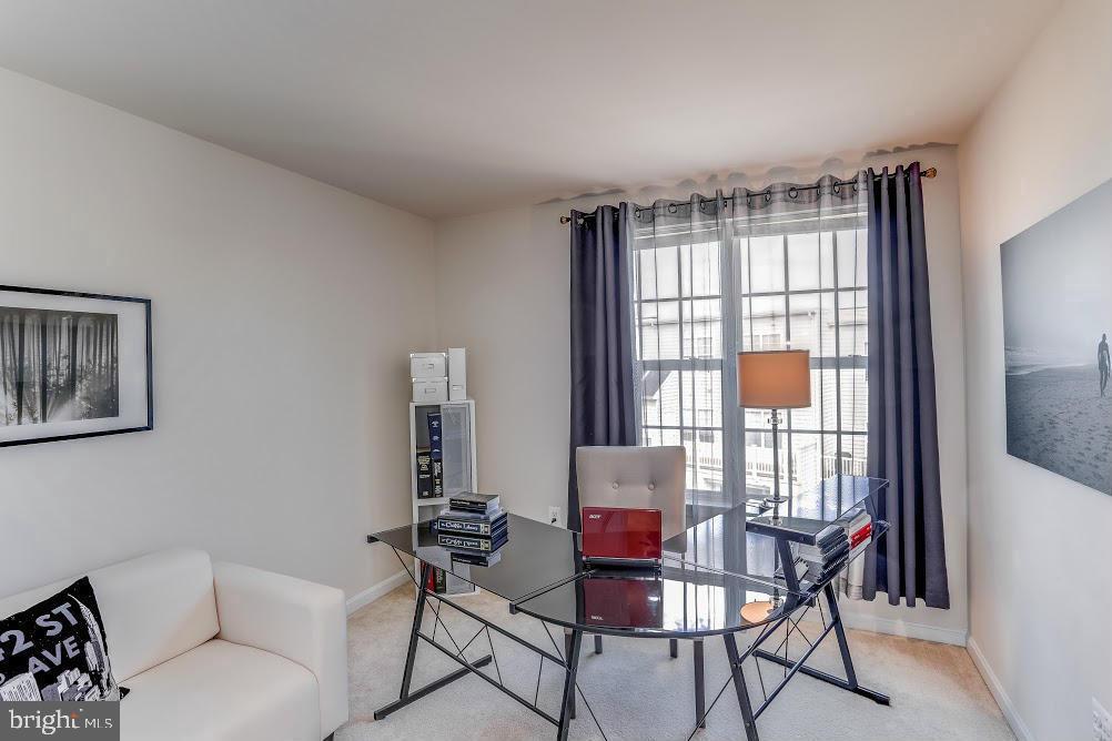 1838 B Monocacy View Circle, Unit 55B Frederick, MD 21701 - Photo 27 of 28 a living room with furniture and a window