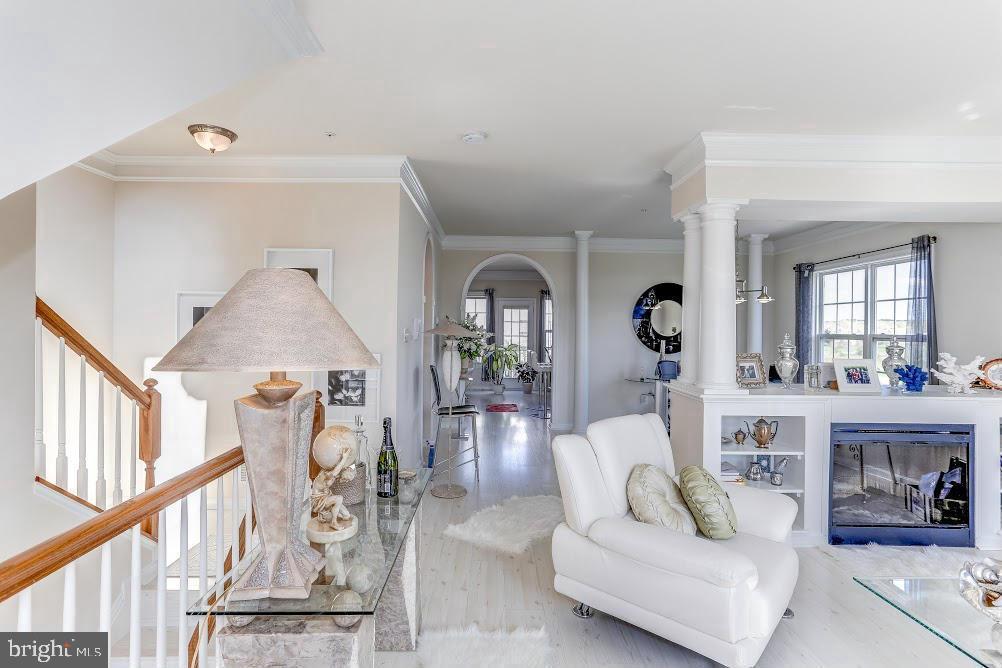 1838 B Monocacy View Circle, Unit 55B Frederick, MD 21701 - Photo 9 of 28 a living room with furniture and wooden floor