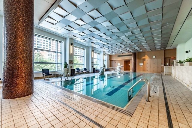 a view of a living room and chandelier