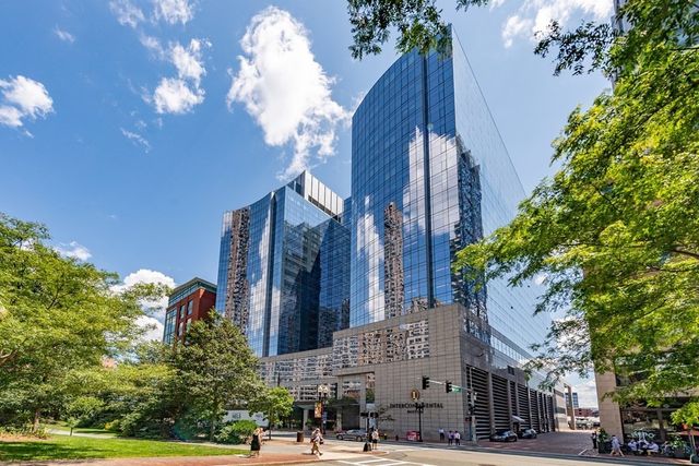a city street lined with buildings and trees