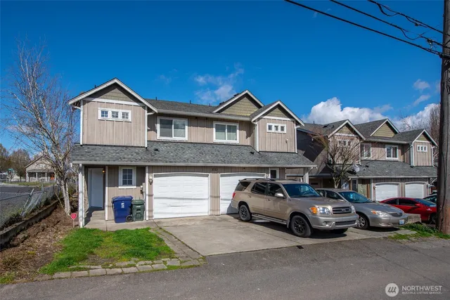 a view of a car parked in front of a house
