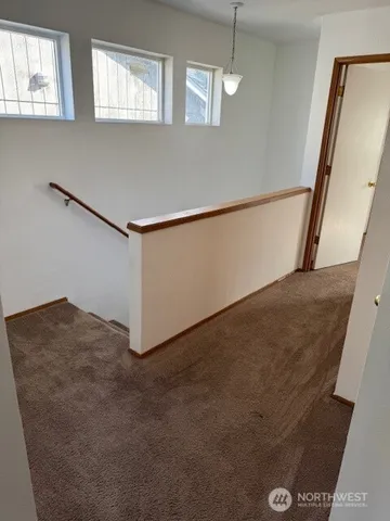 a view of empty room with windows