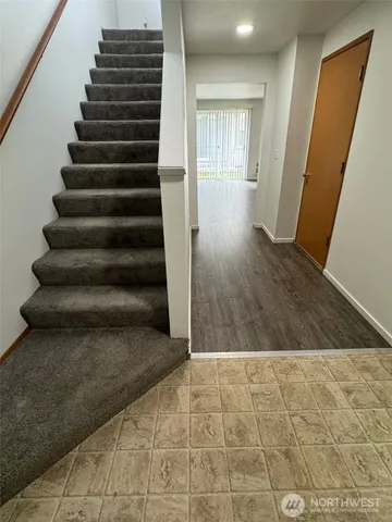 a view of entryway with wooden floor