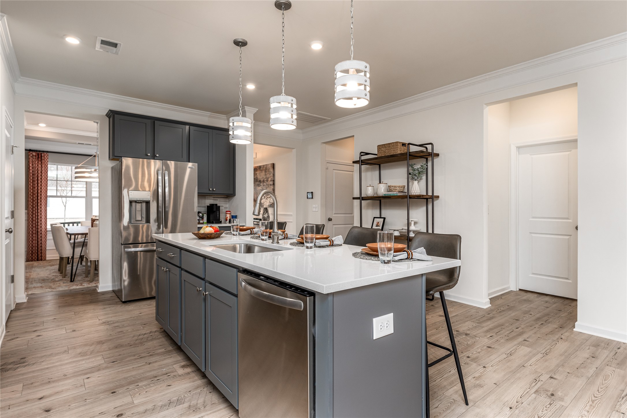 32519 Vly Redstem Way Fulshear, TX 77441 - Photo 6 of 16 The Palmer- Kitchen. The sample image is a staged model, to be used for illustrative purposes only. Upgrades, options, and colors will vary.