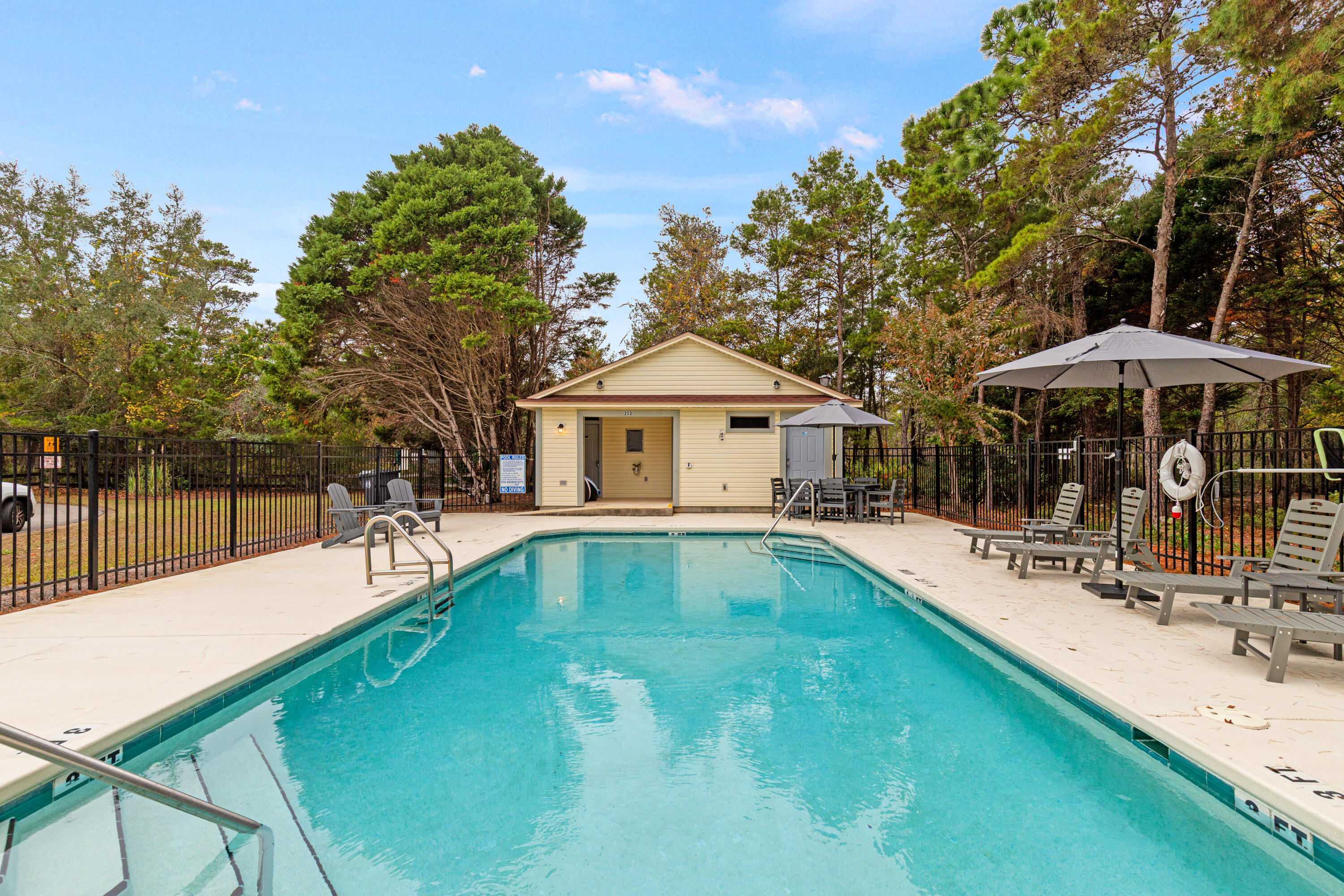 162 Vía Largo, Unit 22B Santa Rosa Beach, FL 32459 - Photo 20 of 26 a swimming pool with outdoor seating and yard