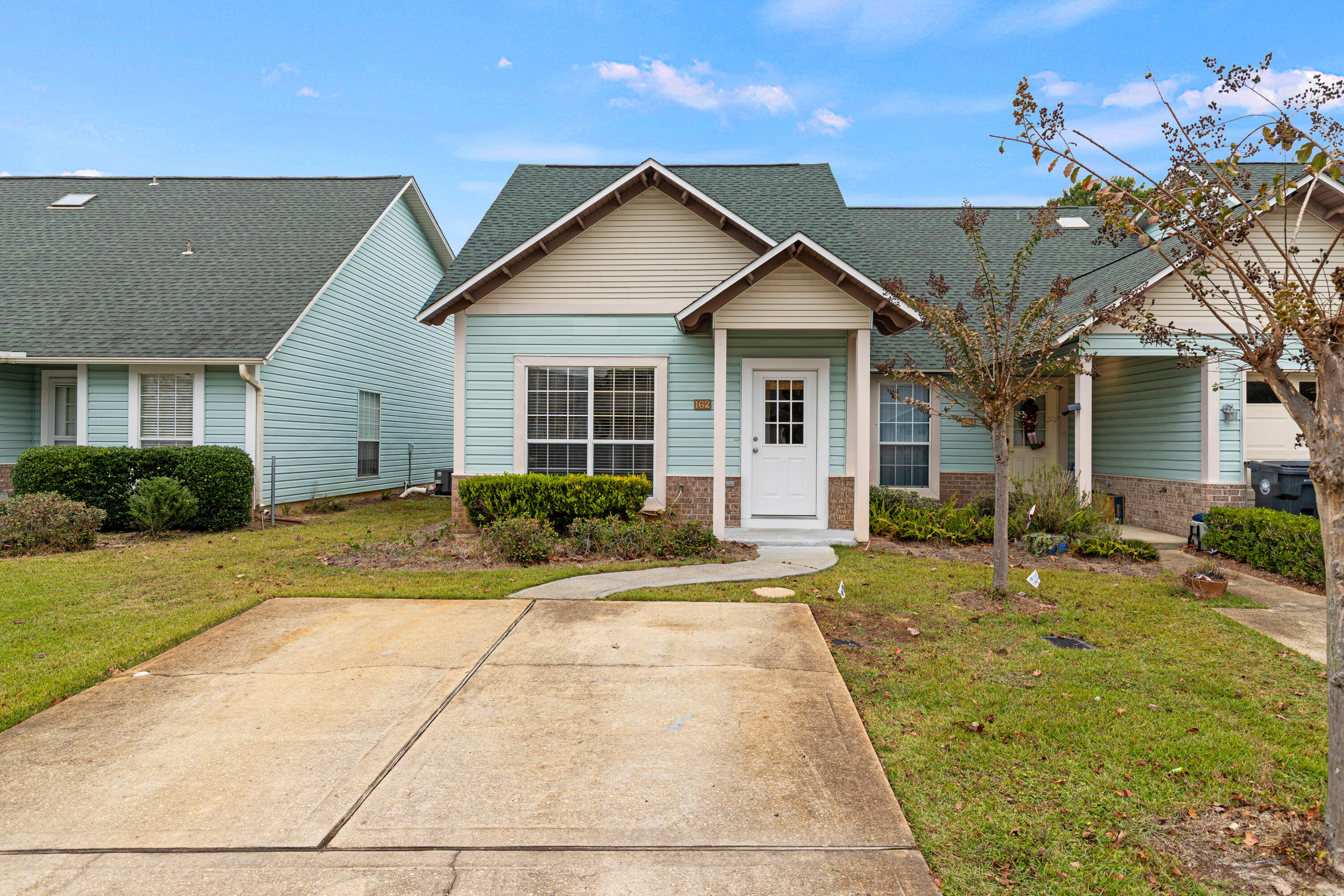 162 Vía Largo, Unit 22B Santa Rosa Beach, FL 32459 - Photo 2 of 26 a view of a yard in front of house