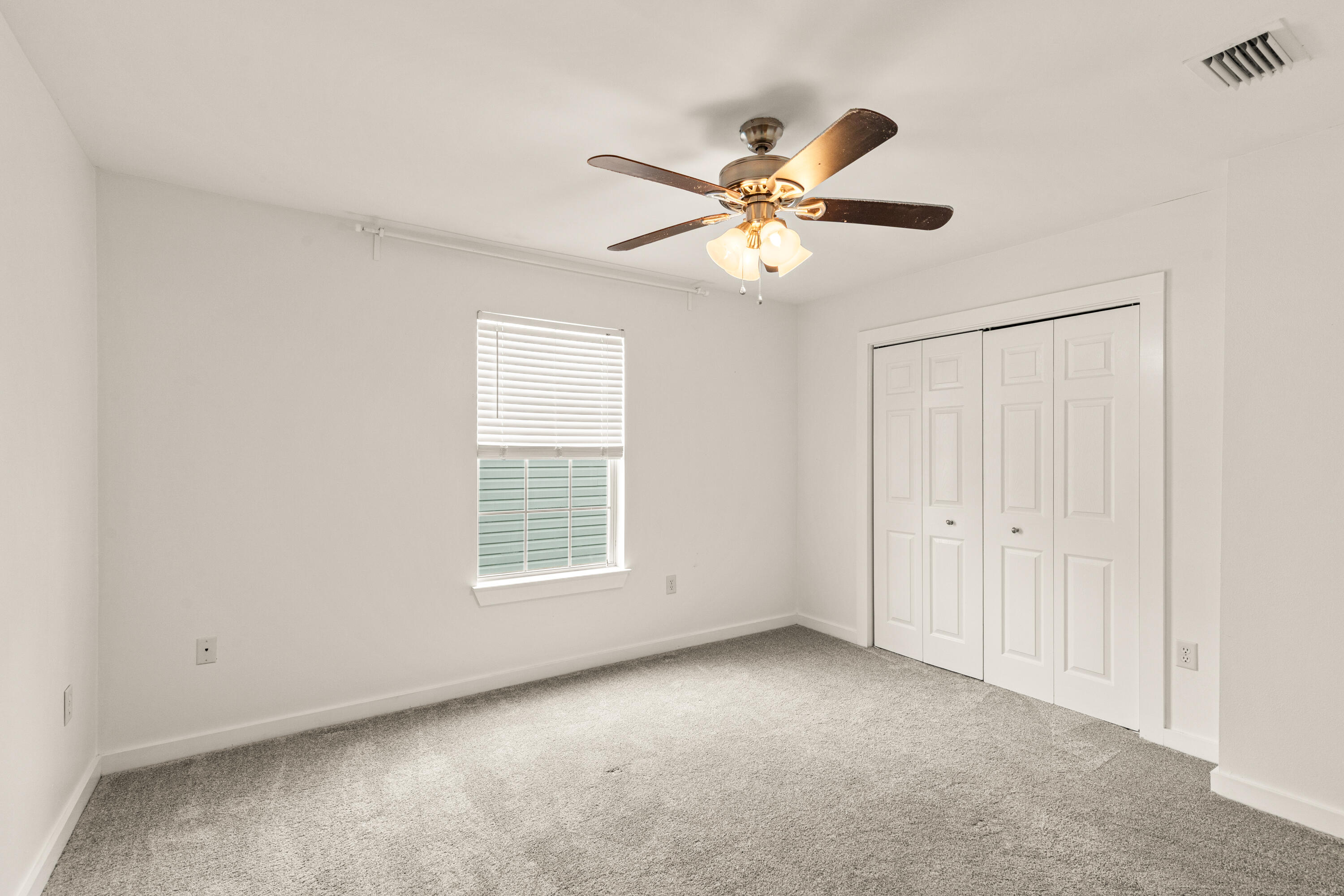 162 Vía Largo, Unit 22B Santa Rosa Beach, FL 32459 - Photo 21 of 26 a view of an empty room with a window
