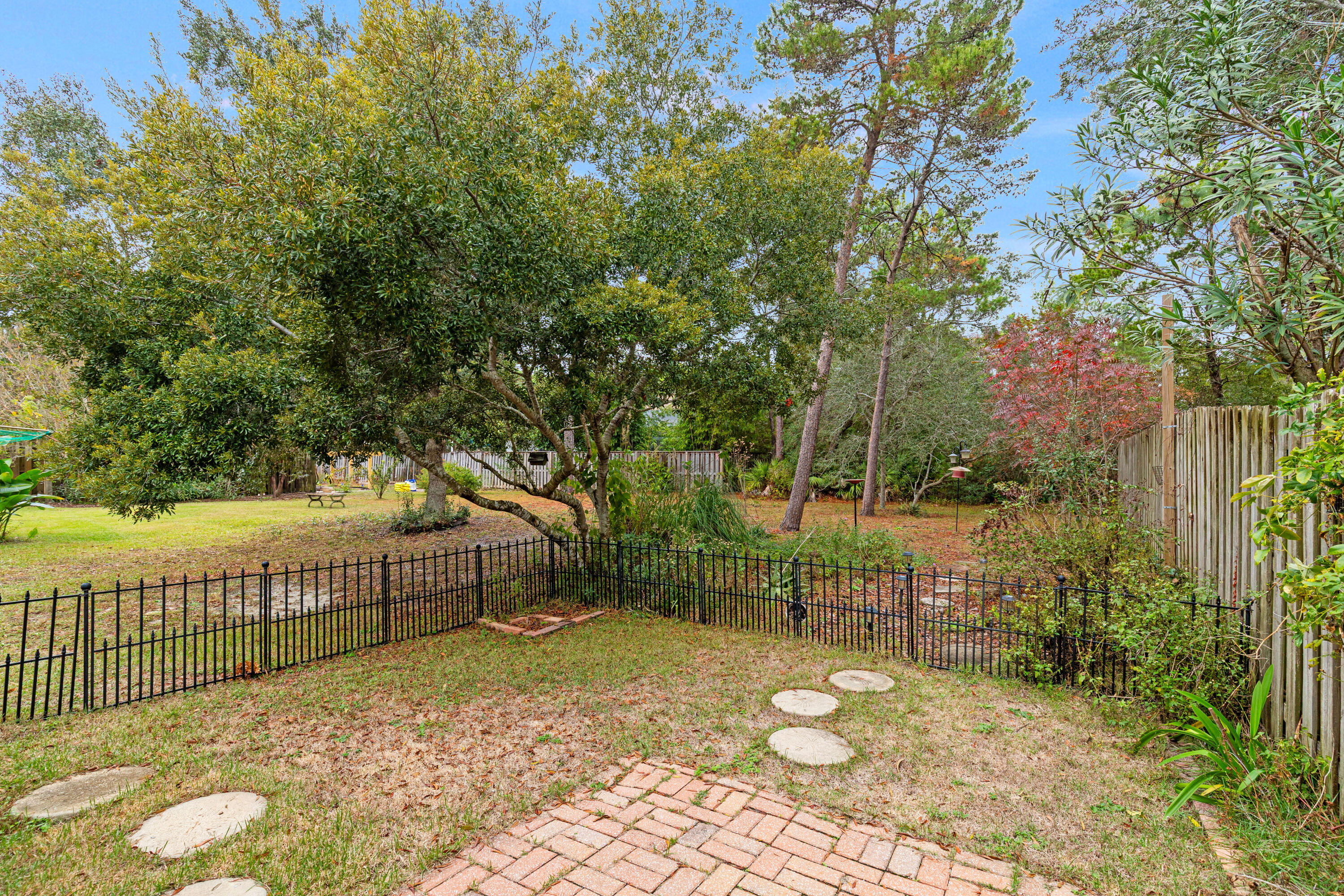 162 Vía Largo, Unit 22B Santa Rosa Beach, FL 32459 - Photo 25 of 26 a view of a bench in backyard
