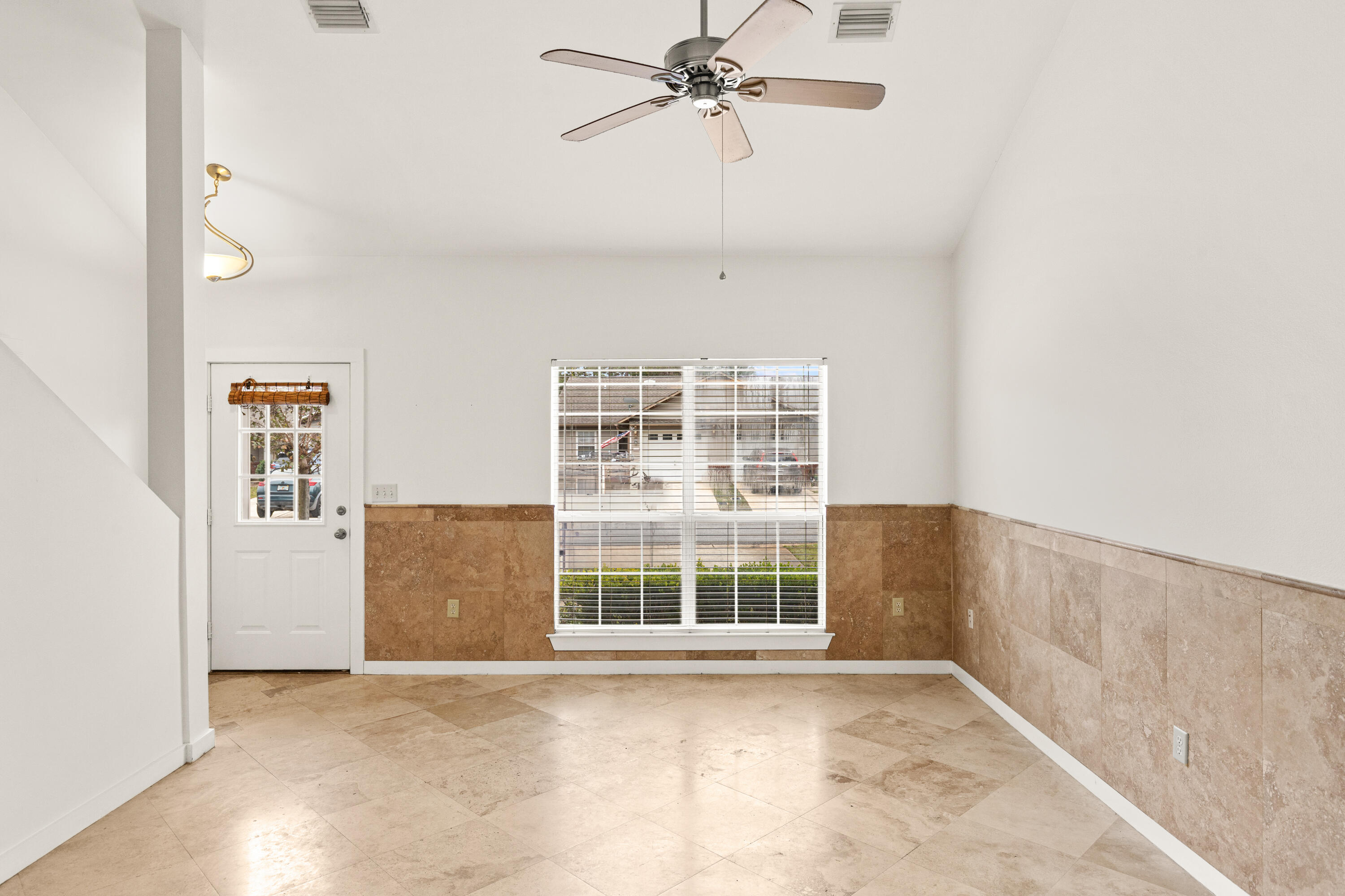 162 Vía Largo, Unit 22B Santa Rosa Beach, FL 32459 - Photo 9 of 26 a view of a livingroom with a ceiling fan and window