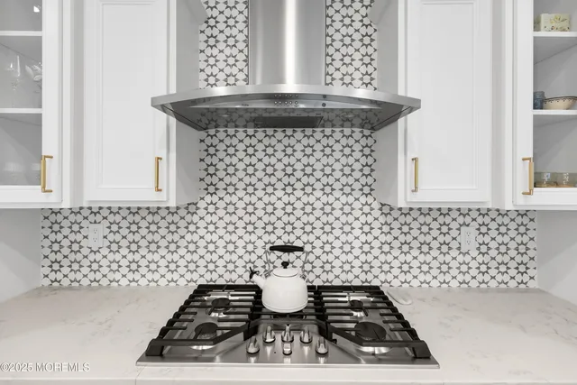 a kitchen with a stove and cabinets