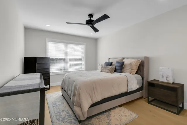 a bedroom with a bed and a television