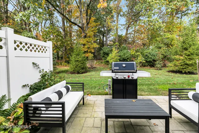 a view of a wooden deck and a yard