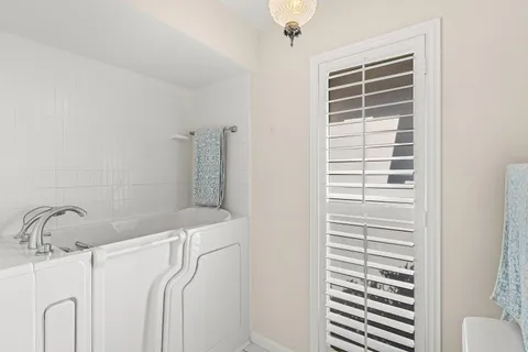 a bathroom with a shower and a sink