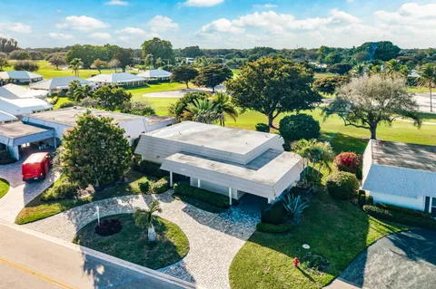 an aerial view of a houses with outdoor space