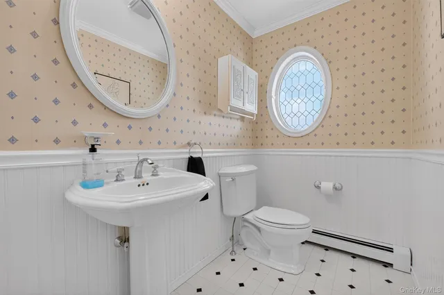 a bathroom with a sink a mirror and a toilet