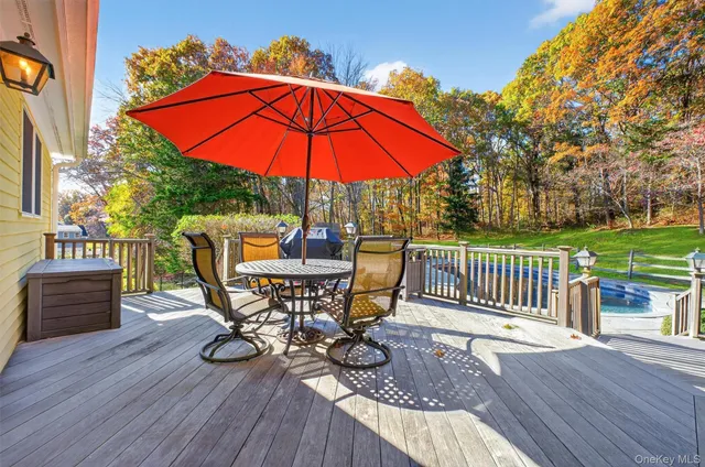 a view of a chair and table on the wooden floor