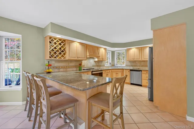 a dining room with furniture and window