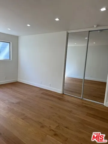 an empty room with wooden floor