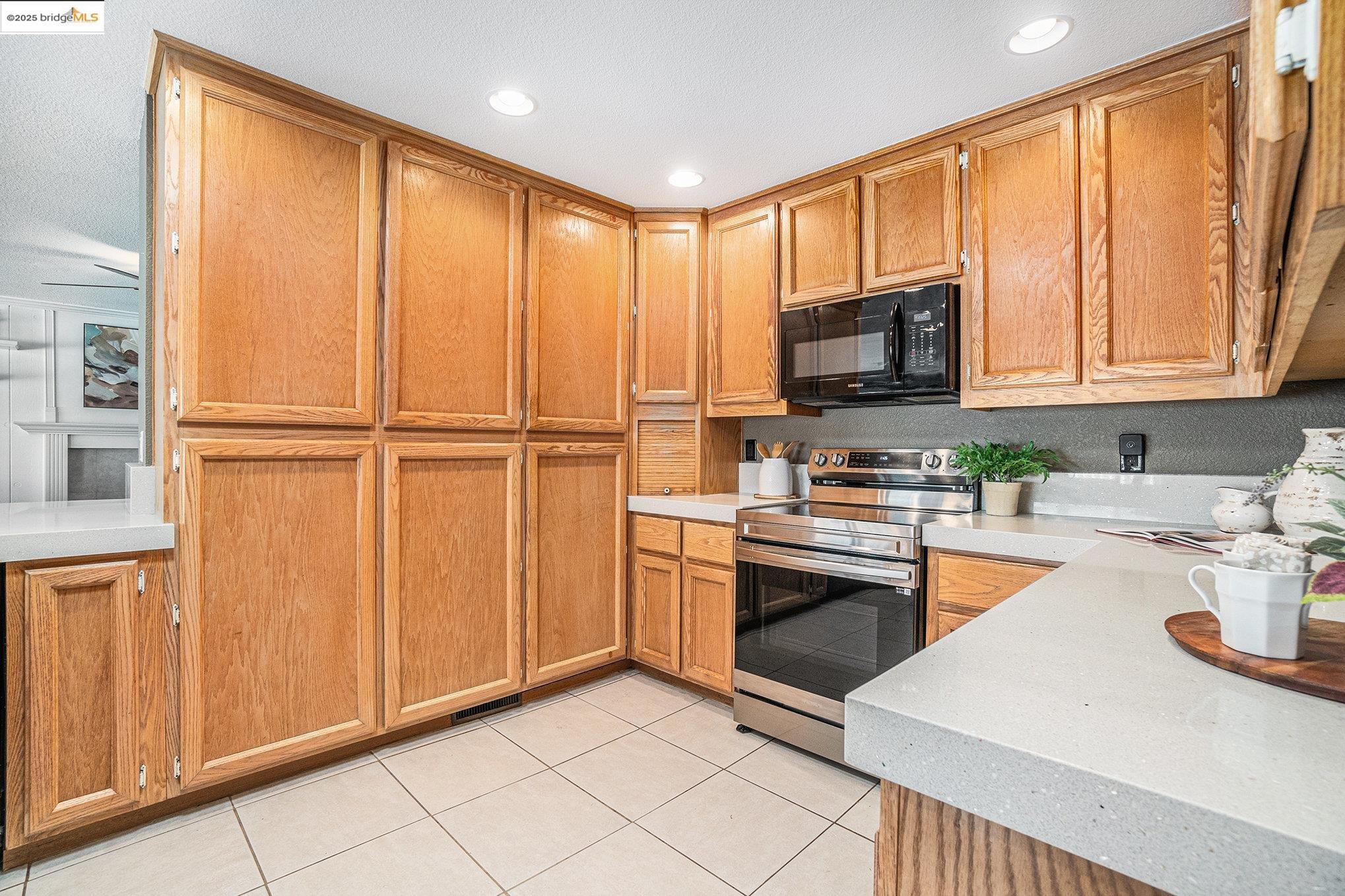870 Willow Lake Road Discovery Bay, CA 94505 - Photo 12 of 39 a kitchen with stainless steel appliances granite countertop a refrigerator stove and sink