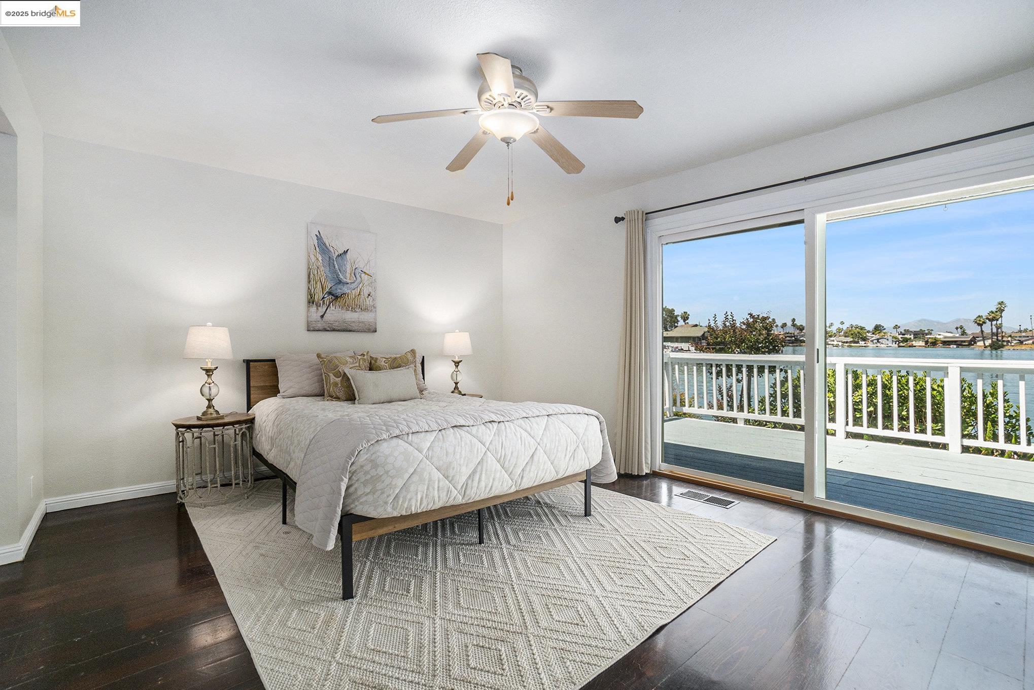 870 Willow Lake Road Discovery Bay, CA 94505 - Photo 15 of 39 a bedroom with a bed and a large window