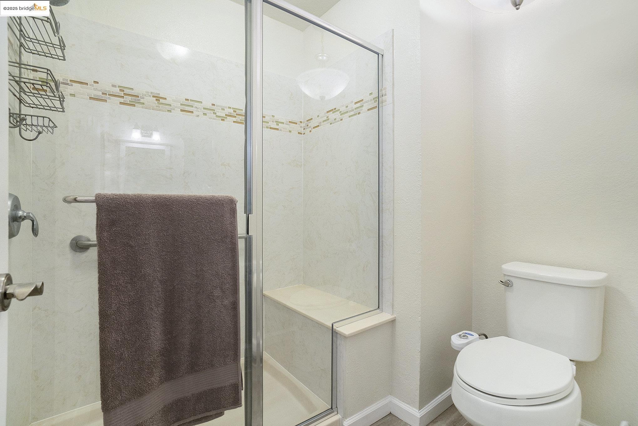 870 Willow Lake Road Discovery Bay, CA 94505 - Photo 18 of 39 a bathroom with a toilet a sink and shower