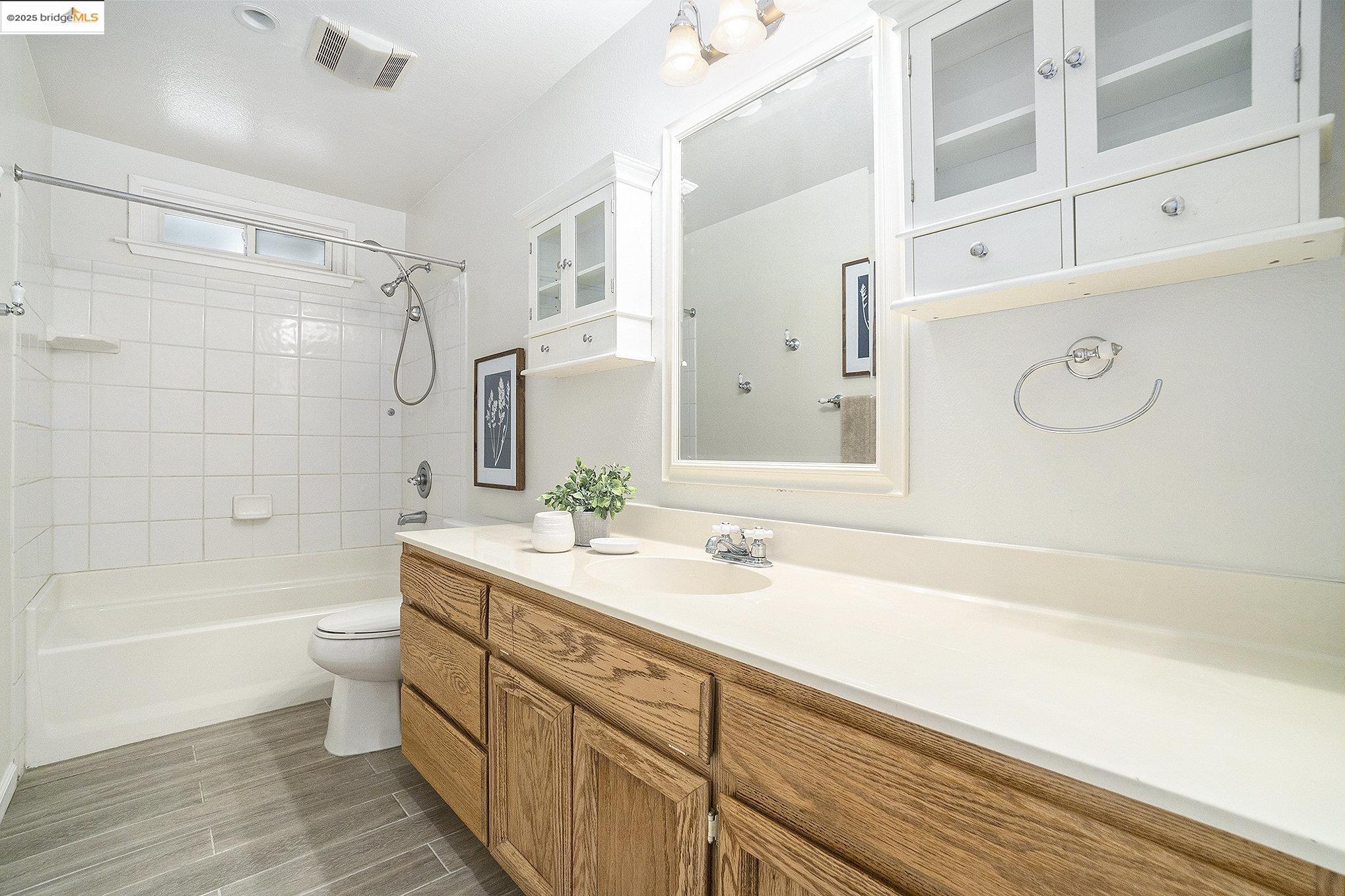 870 Willow Lake Road Discovery Bay, CA 94505 - Photo 20 of 39 a bathroom with a sink a toilet and shower