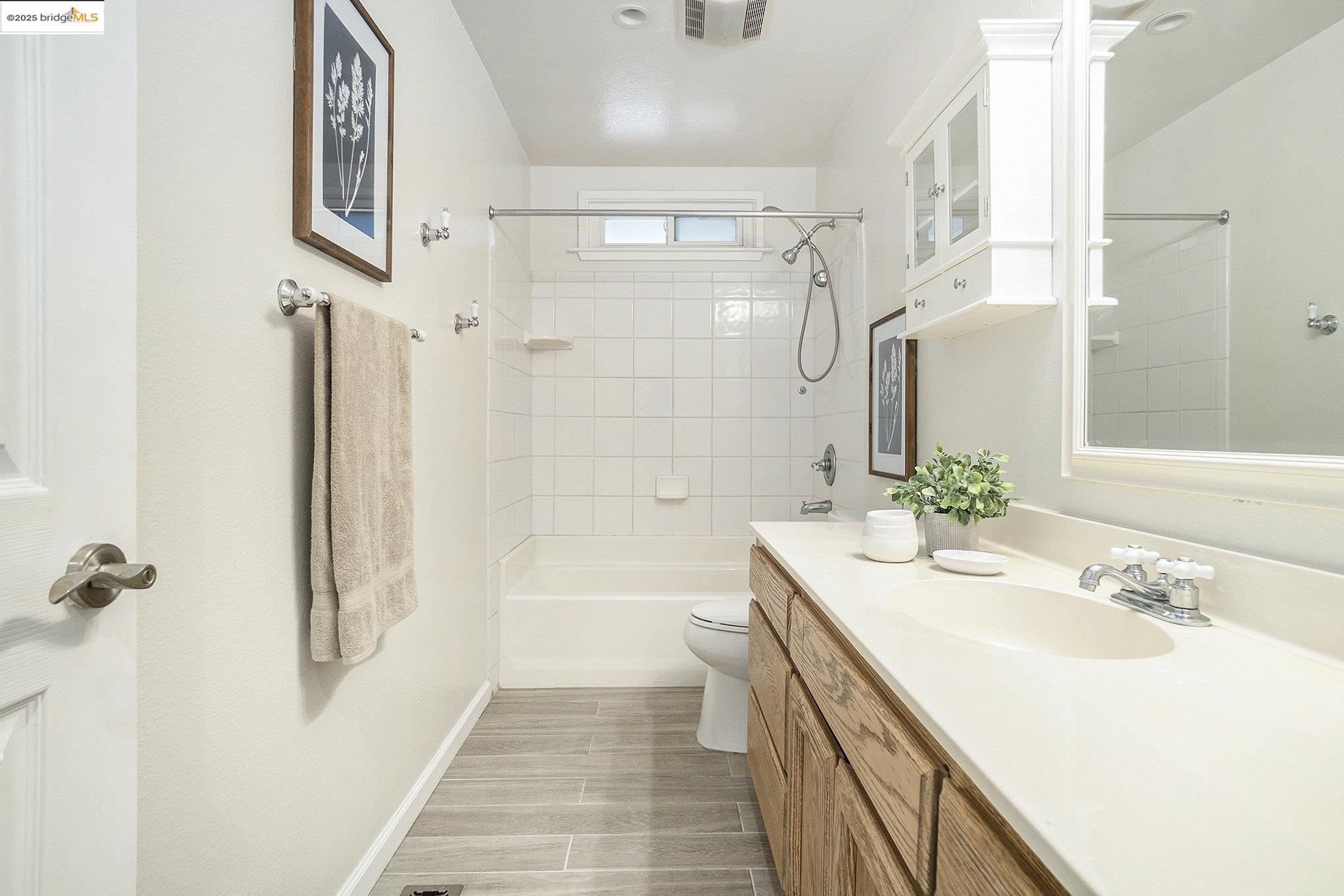 870 Willow Lake Road Discovery Bay, CA 94505 - Photo 21 of 39 a bathroom with a sink a toilet and shower