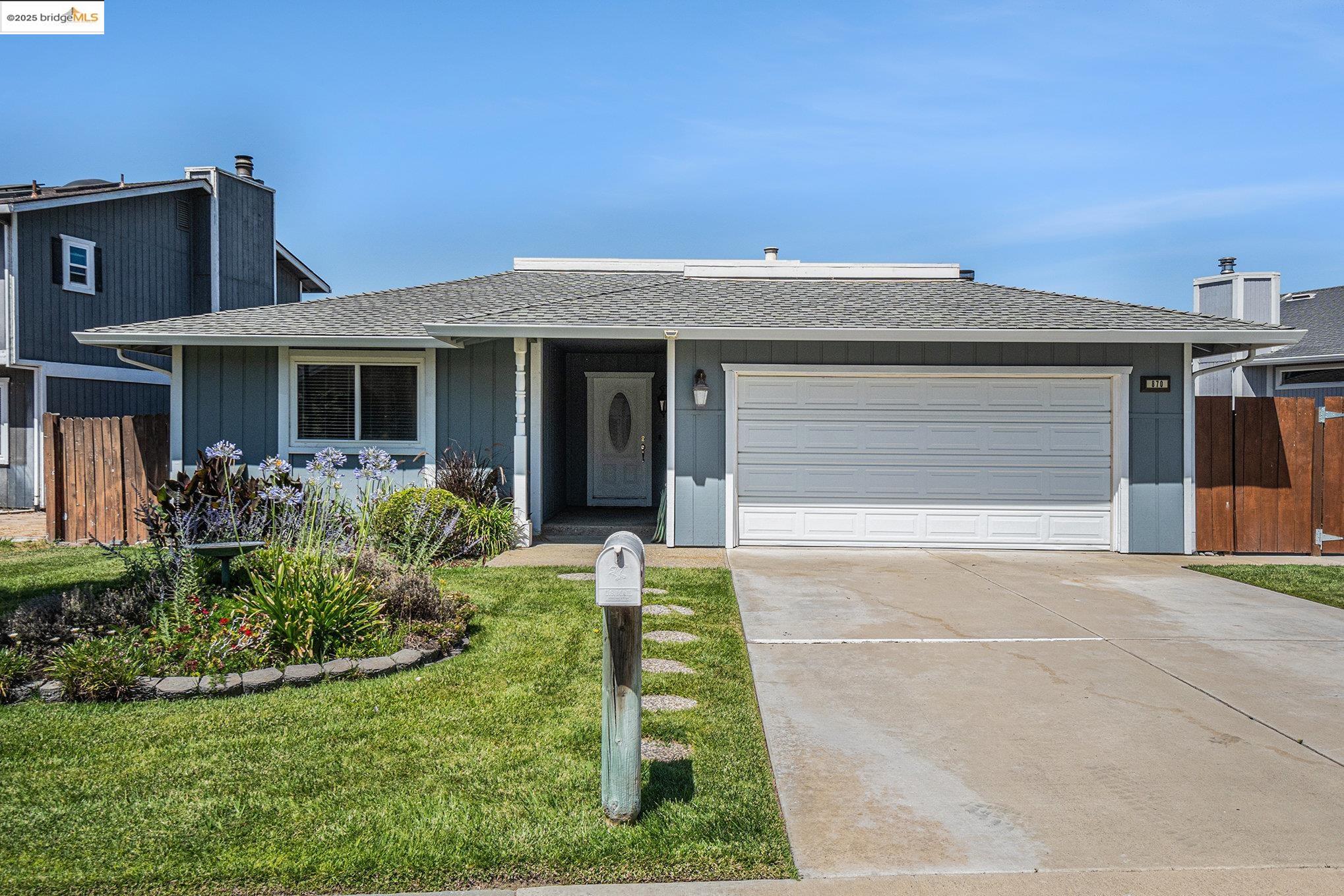 870 Willow Lake Road Discovery Bay, CA 94505 - Photo 3 of 39 a front view of a house with garden