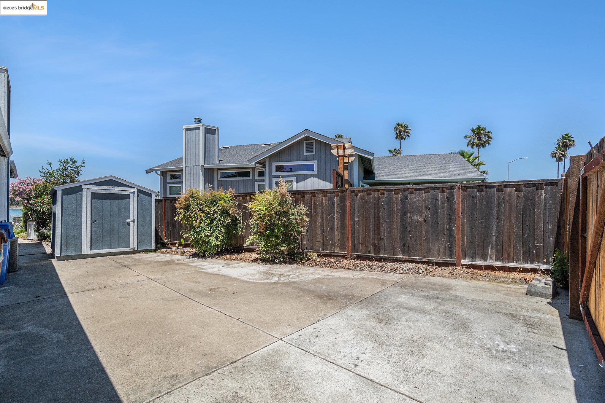 870 Willow Lake Road Discovery Bay, CA 94505 - Photo 33 of 39 a view of a house with wooden fence