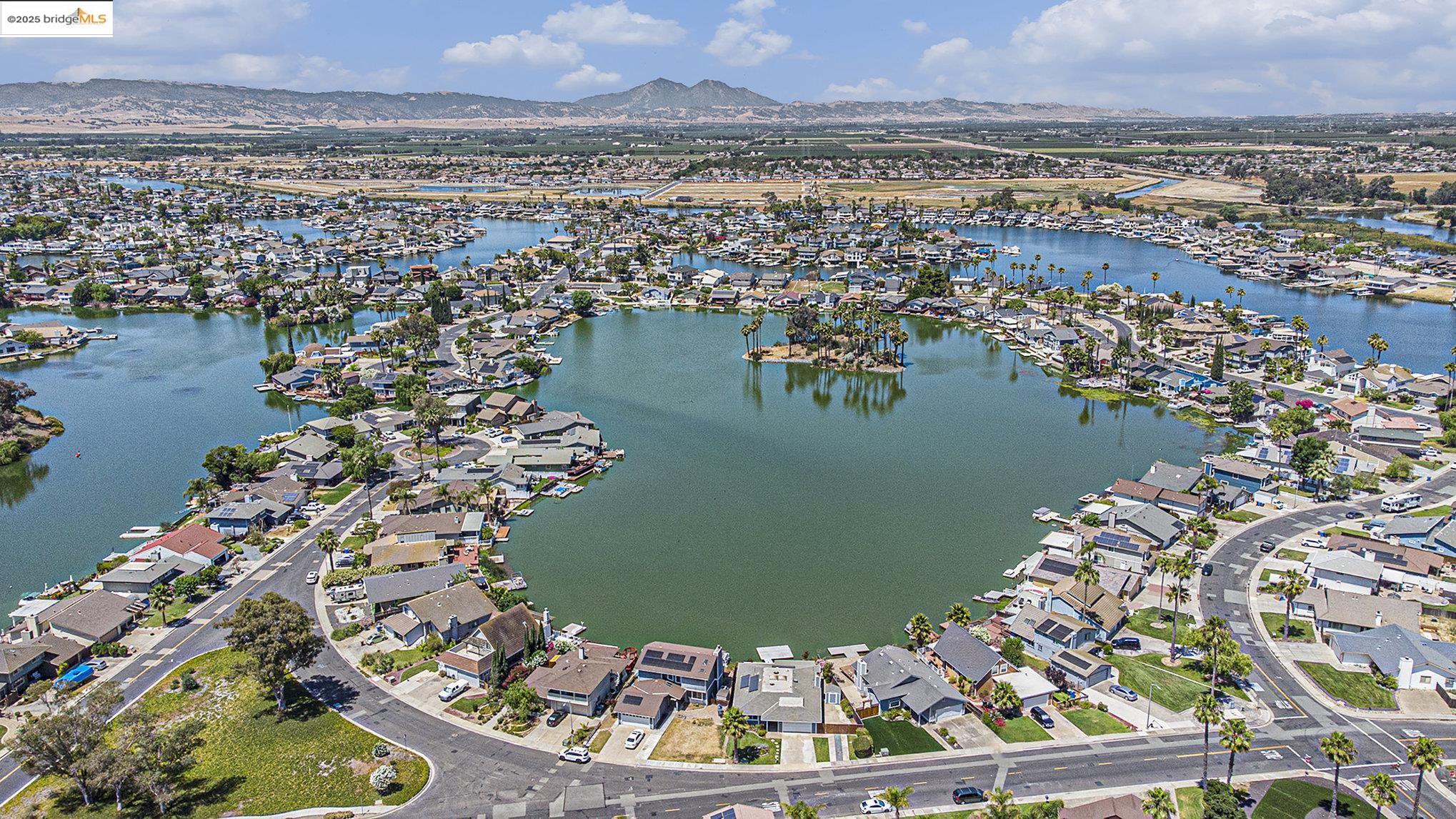 870 Willow Lake Road Discovery Bay, CA 94505 - Photo 36 of 39 an aerial view of a house with a lake view