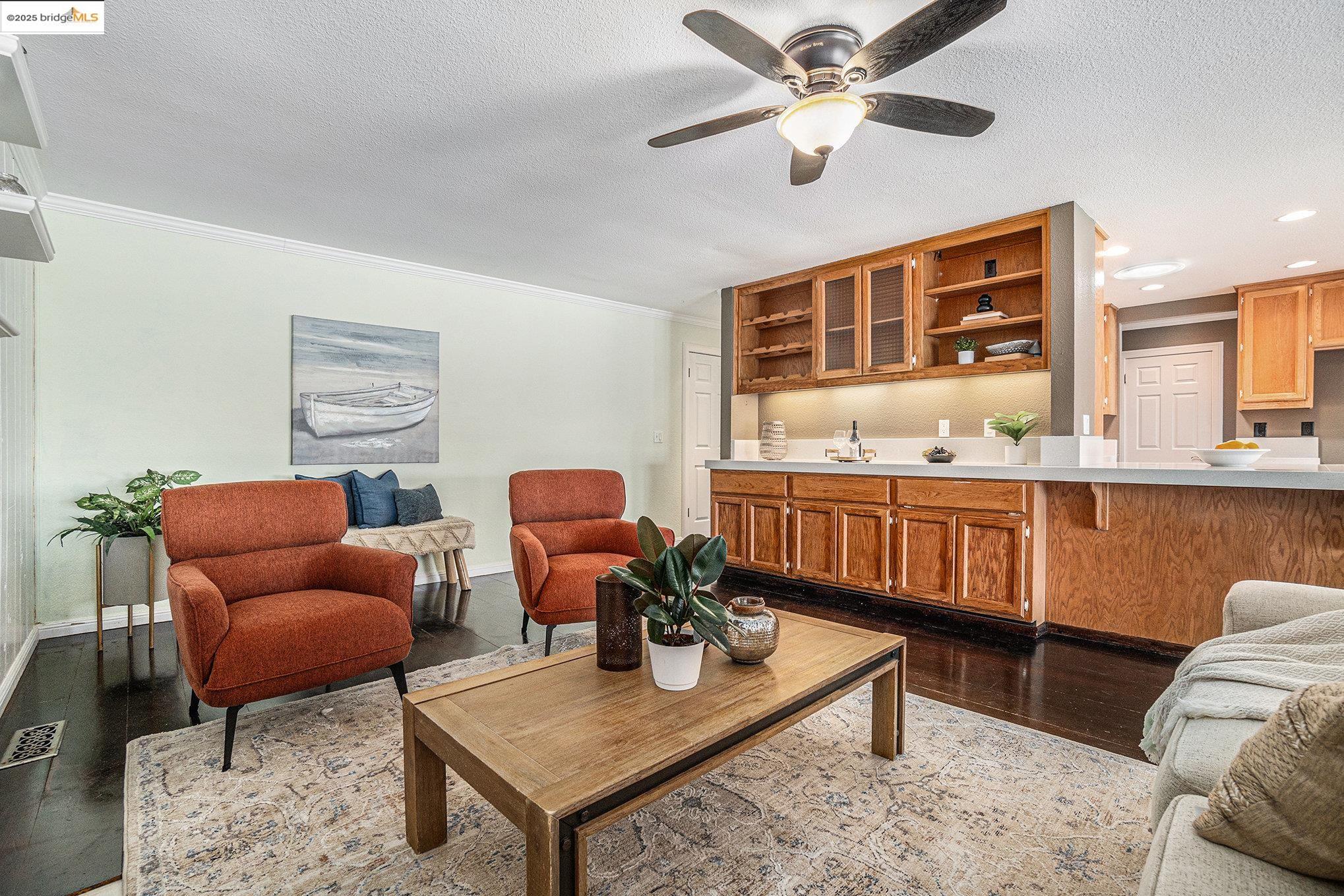 870 Willow Lake Road Discovery Bay, CA 94505 - Photo 5 of 39 a living room with furniture a window and a chandelier