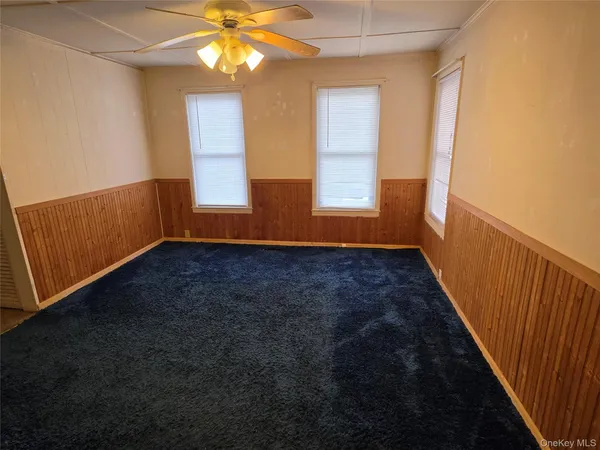 a view of room with window and hardwood floor