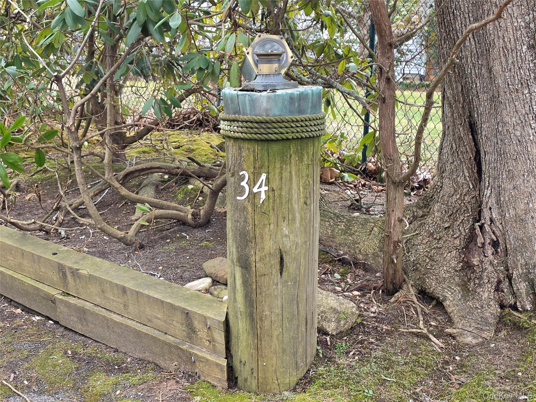 28-34 Townsend Avenue Flanders, NY 11901 - Photo 5 of 11 a view of a pathway of a house with large trees