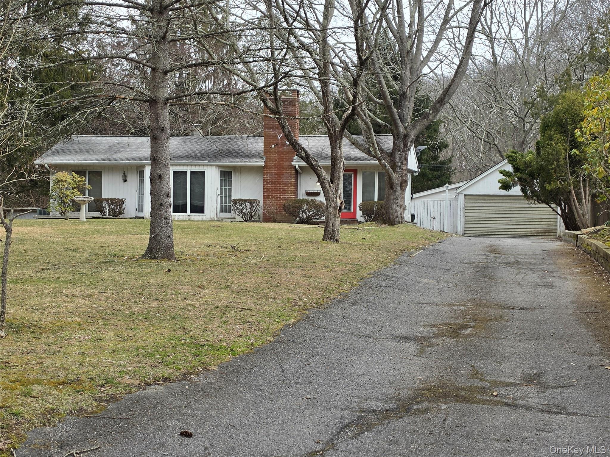 28-34 Townsend Avenue Flanders, NY 11901 - Photo 6 of 11 a front view of a house with a yard