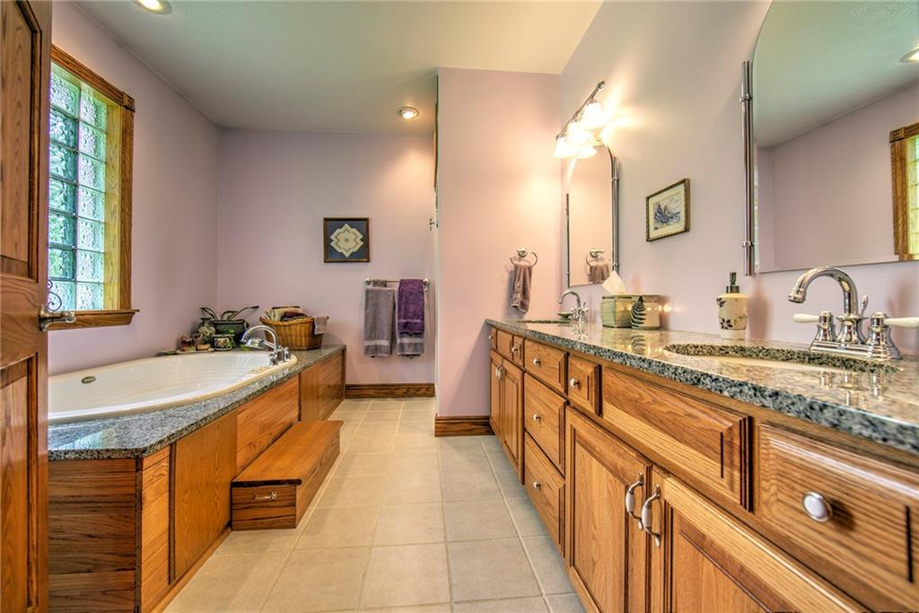 2857 Winner Road Clark, PA 16113 - Photo 13 of 25 Master Bath No. 1 features a double bowl vanity, Jacuzzi tub, separate shower, tiled floor and oak cabinetry.