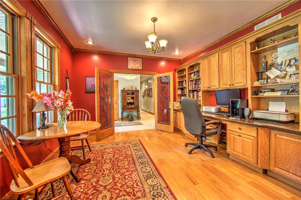 2857 Winner Road Clark, PA 16113 - Photo 4 of 25 13x13 Home Office/Den with plenty of natural light, built in desk, cabinetry, and shelving. Double leaded glass doors lead to the entry way. Perfect space to operate a home business but still keep your living space private.