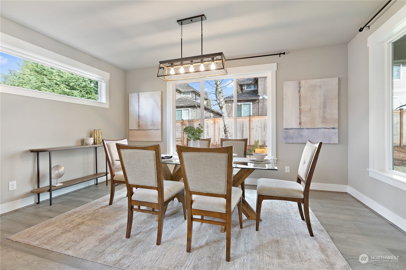 5626 Northeast 2nd Street Renton, WA 98059 - Photo 12 of 40 a dining room with furniture a chandelier and window