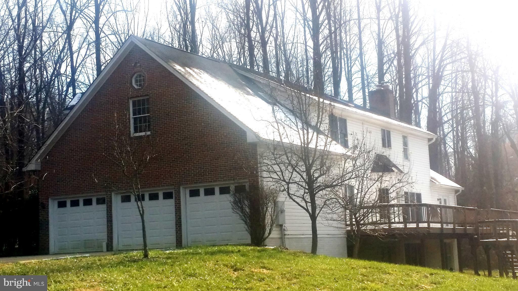 1310 Scotts Run Road McLean, VA 22102 - Photo 2 of 19 3 car garage and brick sides and large deck