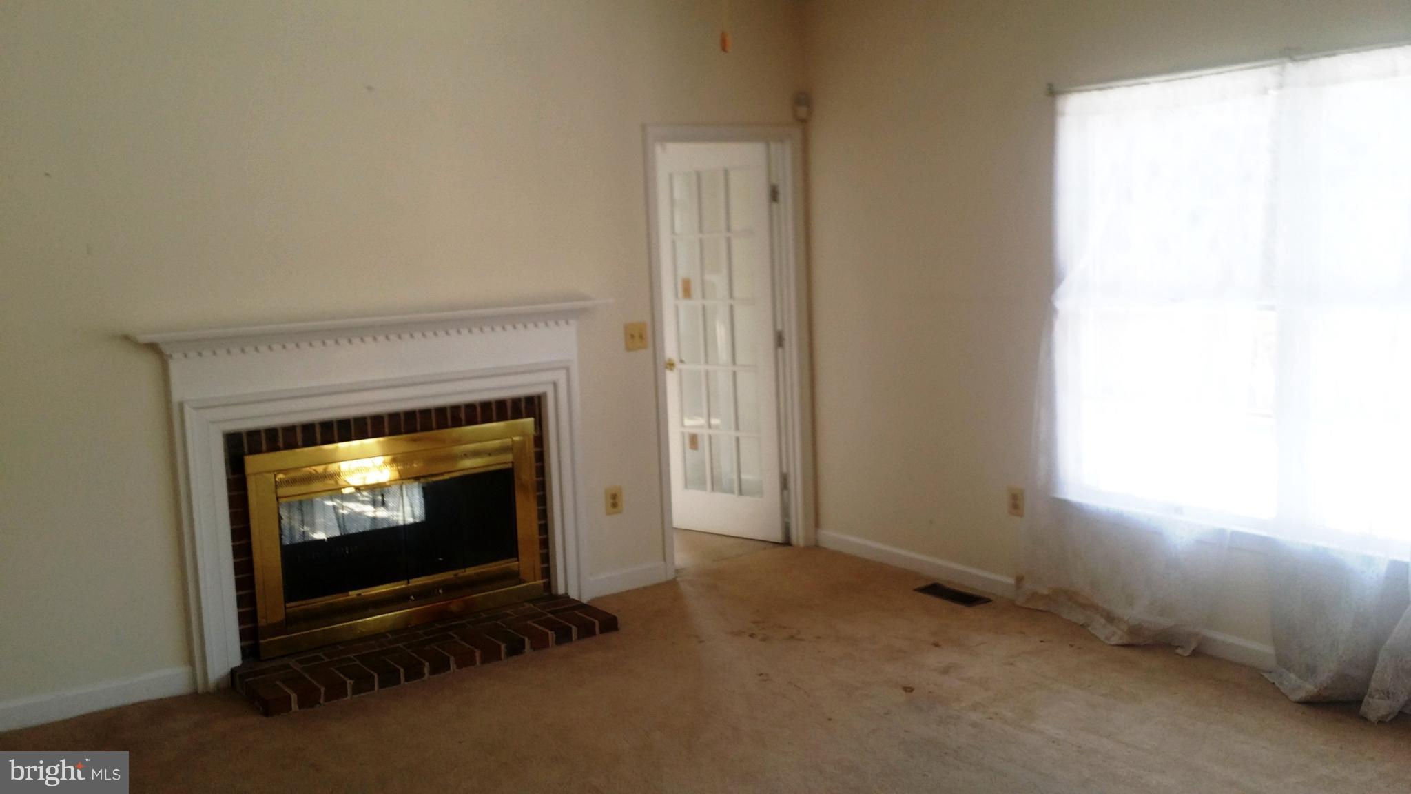 1310 Scotts Run Road McLean, VA 22102 - Photo 6 of 19 Family Room with FP off of Kitchen