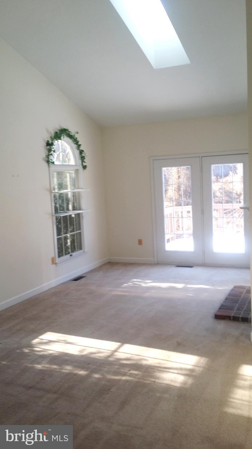 1310 Scotts Run Road McLean, VA 22102 - Photo 8 of 19 Separate Sun room with cathedral ceilings and FP