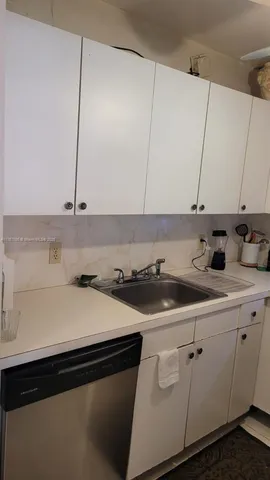 a kitchen with a stove and a refrigerator