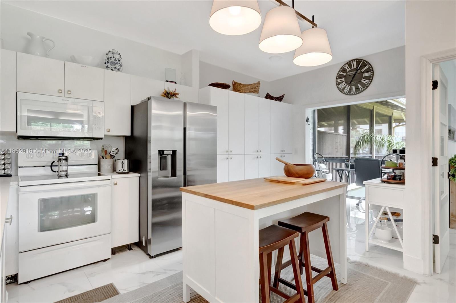7616 Elm Ridge Drive, Unit 7U Boca Raton, FL 33433 - Photo 13 of 36 a kitchen with a refrigerator and a stove top oven