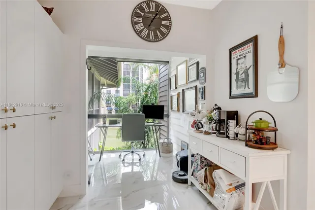 a dining room with furniture and a window