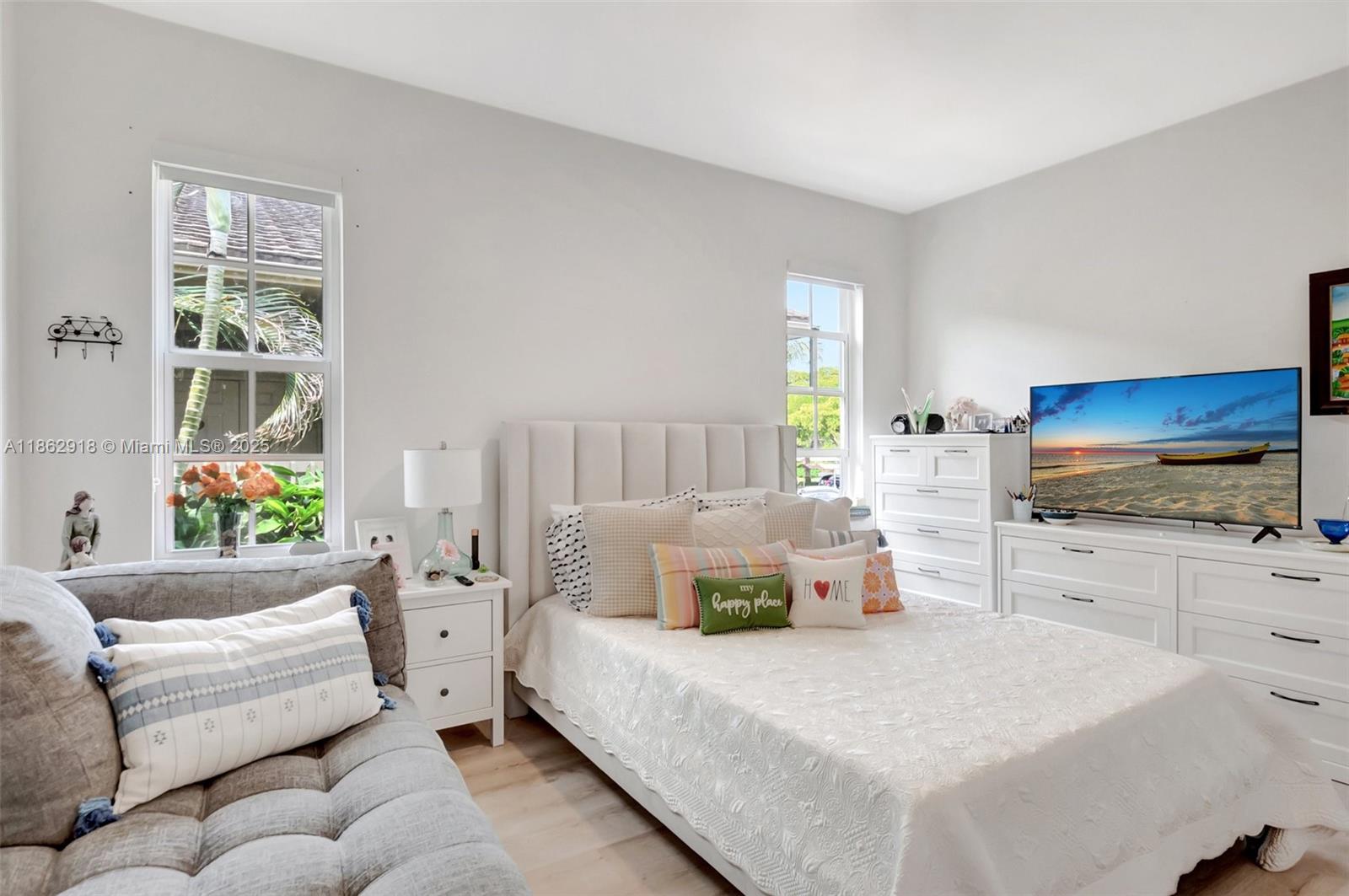 7616 Elm Ridge Drive, Unit 7U Boca Raton, FL 33433 - Photo 15 of 36 a bedroom with bed and window