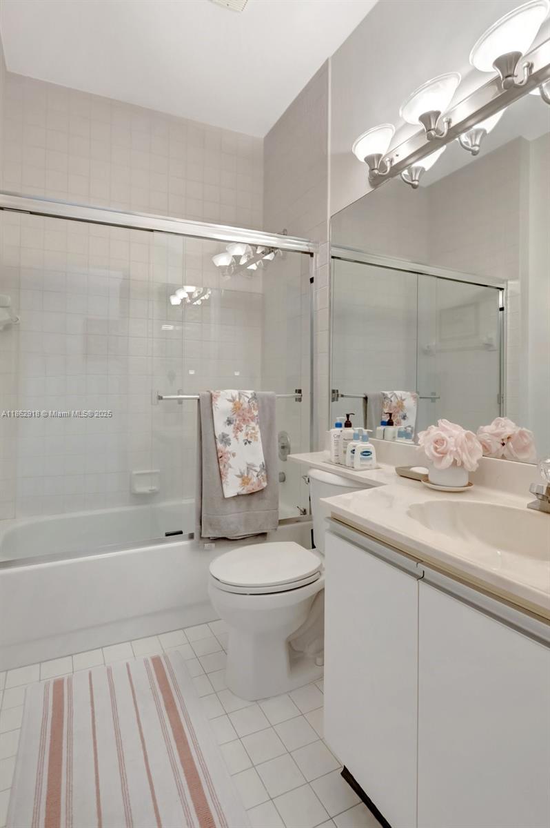 7616 Elm Ridge Drive, Unit 7U Boca Raton, FL 33433 - Photo 18 of 36 a bathroom with a sink toilet and shower