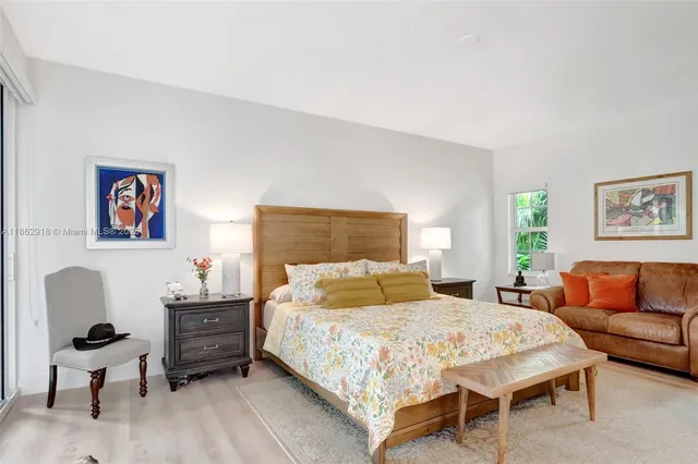 a bedroom with a bed and furniture