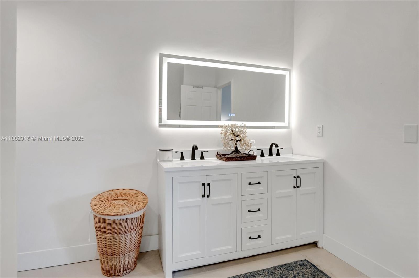 7616 Elm Ridge Drive, Unit 7U Boca Raton, FL 33433 - Photo 23 of 36 a bathroom with a toilet a sink a vanity and mirror