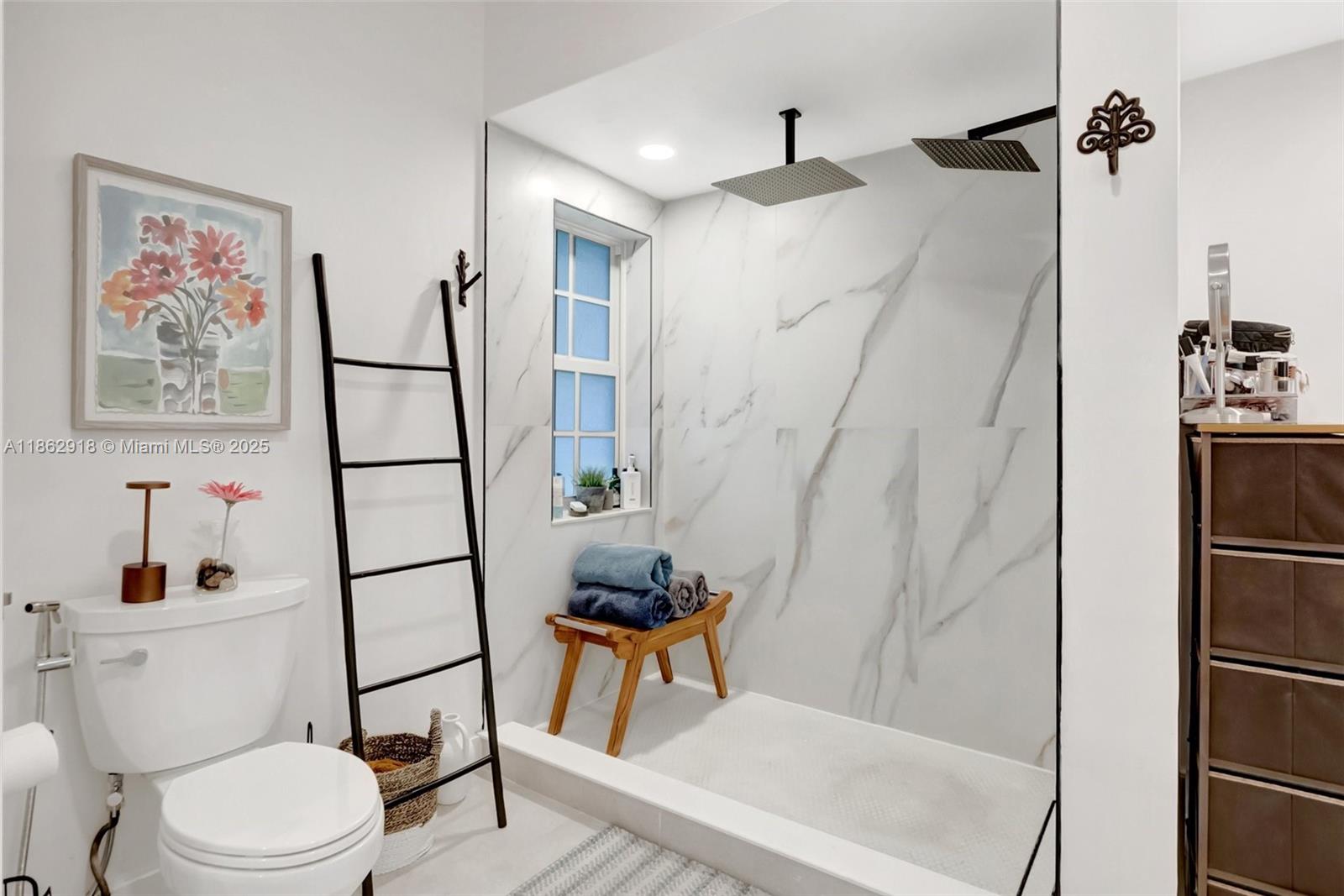 7616 Elm Ridge Drive, Unit 7U Boca Raton, FL 33433 - Photo 24 of 36 a bathroom with a toilet and a shower